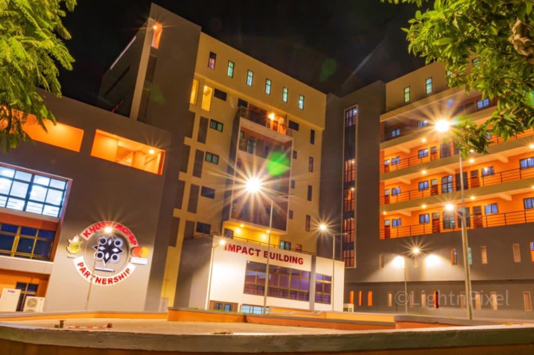 Night view of the KNUST Impact Building facade on the Kumasi campus